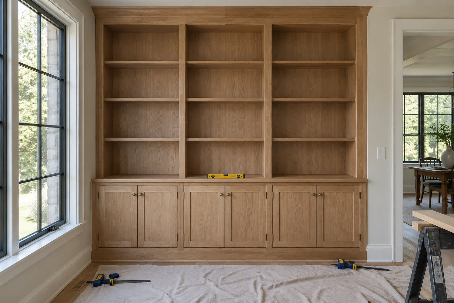 Custom millwork installed on-site — cabinetry built in our own studio, fitted with the precision of fine furniture.